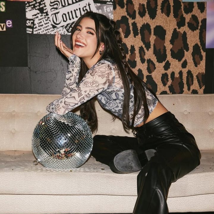Post 4 by charli fanpage! 🤍 on Instagram (carousel)